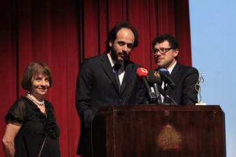 Luca giving a word and Carlo with Festival Director Colette Naufal to the left